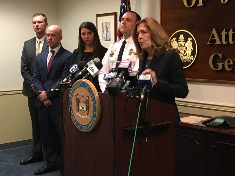 Delaware Attorney General Kathy Jennings stands with Newark Police Lt. Andrew Rubin at a Wilmington press conference detailing how investigators used DNA evidence and a private database to identify a suspect charged in a 1993 sexual assault in Newark. (Mark Eichmann/WHYY)