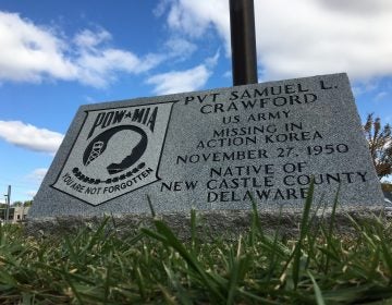 A monument outside the Route 9 Library in New Castle honors the memory of Samuel Crawford, a Wilmington soldier who went missing in action in North Korea in 1950. (Mark Eichmann/WHYY)