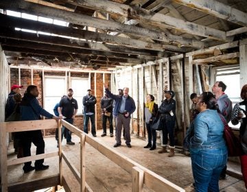 Jumpstart Germantown participants talk development at a project site. (Courtesy of Jumpstart Germantown)