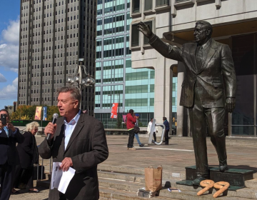 'That’s good news,' says 1210WPHT radio host Dom Giordano on Wednesday upon learning of the Kenney administration’s new schedule for removing the Frank Rizzo statue in Center City. Giordano spoke an event commemorating the 99th birthday of the former mayor, where supporters placed Italian bread loaves in the shape of the number 99 at the based of the statue. (Michael D'Onofrio/The Philadelphia Tribune)