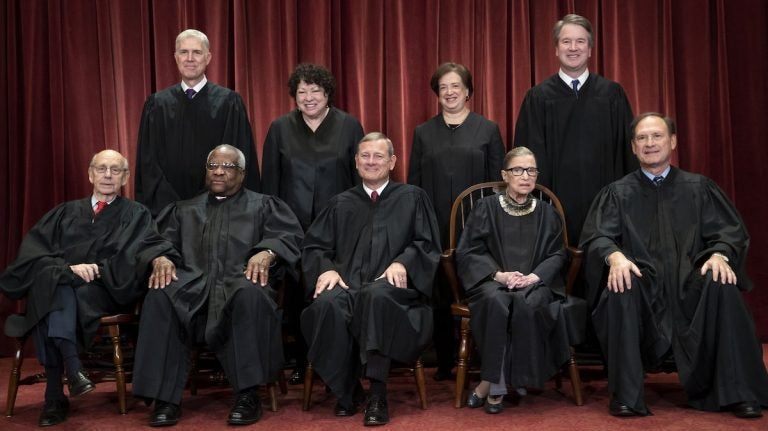 The Supreme Court justices, pictured in November 2018, start a new term on Monday. (J Scott Applewhite/AP)