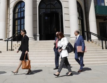 Attorneys and other people leave the U.S. District Court in September after Purdue Pharma's first hearing since filing for bankruptcy in White Plains, N.Y.
(Seth Wenig/AP Photo)