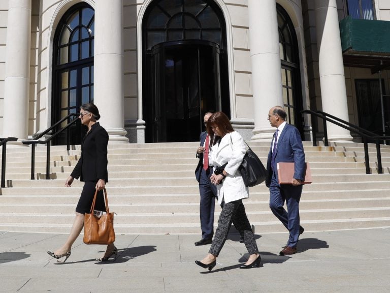 Attorneys and other people leave the U.S. District Court in September after Purdue Pharma's first hearing since filing for bankruptcy in White Plains, N.Y.
(Seth Wenig/AP Photo)
