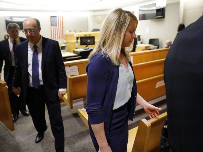 Fired Dallas police officer Amber Guyger leaves the courtroom after a jury found her guilty of murder Tuesday. Guyger shot and killed Botham Jean, an unarmed 26-year-old neighbor in his own apartment last year. She told police she thought his apartment was her own and that he was an intruder. (Tom Fox/Tom Fox/The Dallas Morning News via AP)