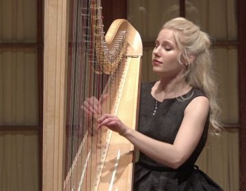 Curtis student Alexandra Tihonova playing the harp.