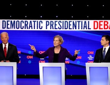 Left to right, former Vice President Joe Biden, Massuchusetts Sen. Elizabeth Warren and South Bend, Ind. Mayor Pete Buttigieg react on stage during the Democratic Presidential Debate at Otterbein University. (Getty Images)