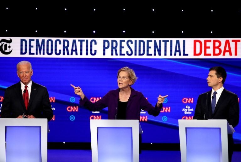 Left to right, former Vice President Joe Biden, Massuchusetts Sen. Elizabeth Warren and South Bend, Ind. Mayor Pete Buttigieg react on stage during the Democratic Presidential Debate at Otterbein University. (Getty Images)