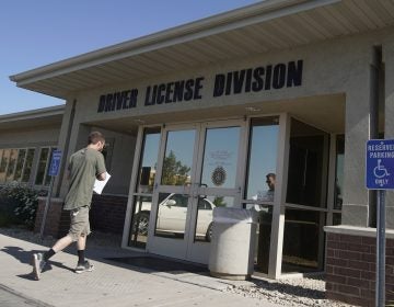 A person walks into a Utah Driver License Division office in July in Orem, Utah. (George Frey/Getty Images)