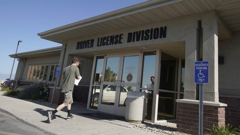 A person walks into a Utah Driver License Division office in July in Orem, Utah. (George Frey/Getty Images)