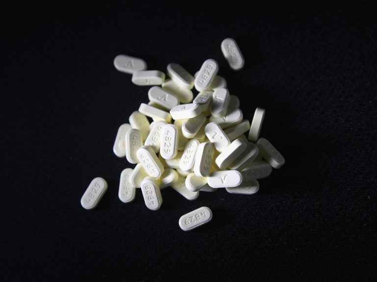 The overprescription of opioid pain medications such as these oxycodone pills has been blamed for an addiction epidemic in the U.S. — and has spurred a flurry of activity in American courts. (John Moore/Getty Images)