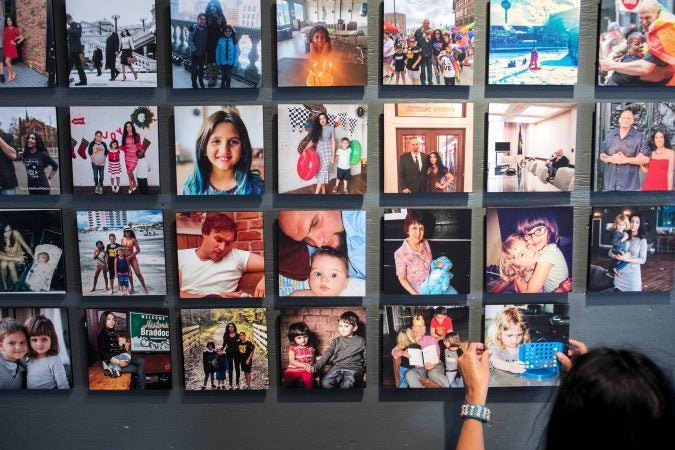 Gisele Fetterman, the Second Lady of Pennsylvania hangs family photos in her Braddock home. Sept. 19, 2019. (Sean Simmers/PennLive) 
