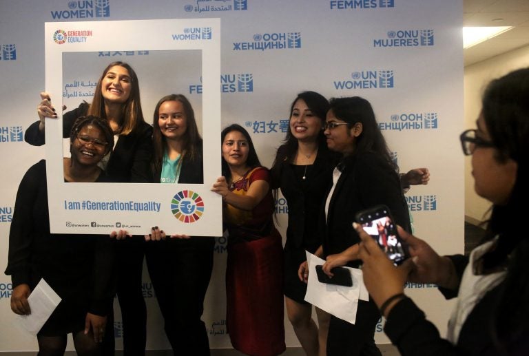 A lighter moment on a serious day: the presentation of a Global Girls' Bill of Rights at the U.N. Left to right: Six of the young women who helped draft the document: Faith Nwando, 17; Djellza Pulatani, 17; Olivia Lombardo, 16; Angelica Morales, 21; Kanchan Amatya, 22; and Vishakha Agrawal, 20. (Yana Paskova for NPR)