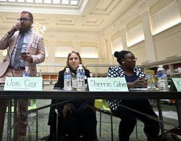 Independent Joe Cox speaks before departing early at the city council candidate forum for the at-large seat, held at the Lillian Marrero Library on Monday.