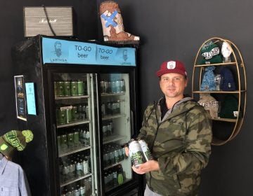 Matt Lindenmuth, founder of the Larimer Beer Company, holds the company’s latest creation “Bird Gang IPA” which debuted Oct. 13. (P. Kenneth Burns/WHYY)