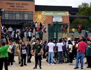 Students spill out of Thomas A. Edison High School at the end of the school day. Students who swipe their identification cards in the morning are considered present for the whole day — even when they cut class. (TOM GRALISH / Philadelphia Inquirer)