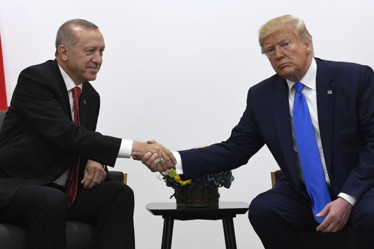 President Donald Trump, right, shakes hands with Turkish President Recep Tayyip Erdogan, left, during a meeting on the sidelines of the G-20 summit in Osaka, Japan, Saturday, June 29, 2019. (AP Photo/Susan Walsh)