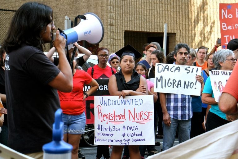 Anel Medina (center), a registered nurse who graduated from Delaware County Community College, joins a rally in support of DACA. (Emma Lee/WHYY)