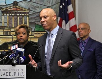 School District of Philadelphia Superintendent William Hite announces the districts plan to improve environmental safety at its schools. He is joined by state Rep. Vincent Hughes (right), City Councilmember Cindy Bass (left), and other local officials. (Emma Lee/WHYY)