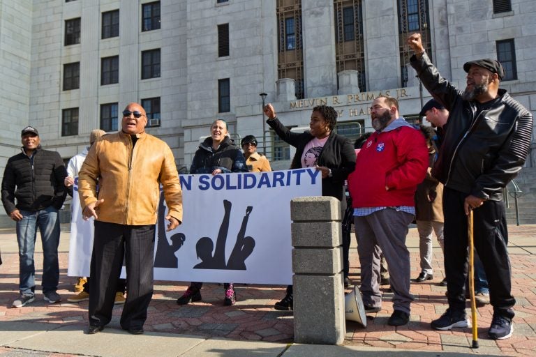 Camden residents opposed to a county take-over of housing inspection and code enforcement rallied in front of Camden City Hall Tuesday. (Kimberly Paynter/WHYY)