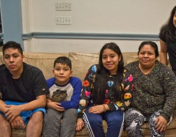 Carmela Apolonio Hernandez, (second from right) with her children Yoselin Artillero Apolonio, 13, (center), Keyri Artillero Apolonio, 15, (right), Edwin Artillero Apolonio, 11, (second from left), and Fidel Artillero Apolonio, 17, (left) in sanctuary at the Germantown Mennonite Church. (Kimberly Paynter/WHYY)