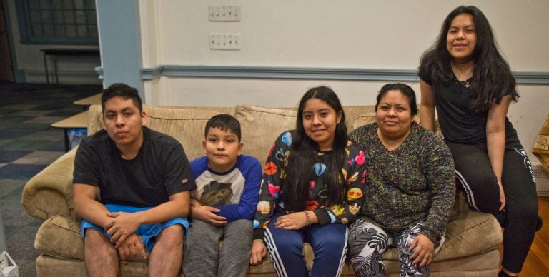 Carmela Apolonio Hernandez, (second from right) with her children Yoselin Artillero Apolonio, 13, (center), Keyri Artillero Apolonio, 15, (right), Edwin Artillero Apolonio, 11, (second from left), and Fidel Artillero Apolonio, 17, (left) in sanctuary at the Germantown Mennonite Church. (Kimberly Paynter/WHYY)