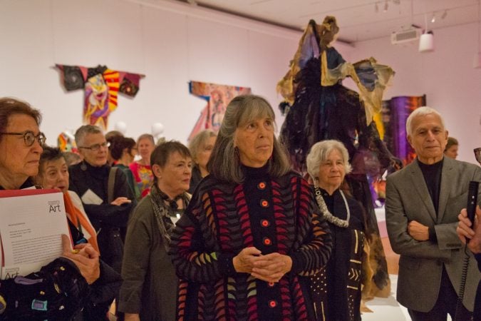 Julie Schafler Dale (center) is the owner of the garment collection in Off the Wall: American Art to Wear, at the Philadelphia Museum of Art. (Kimberly Paynter/WHYY)