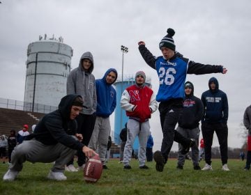 Justin Gabor runs up for a kick during practice at Neshaminy High School. (Kriston Jae Bethel for WHYY)