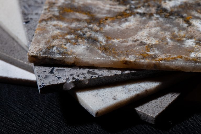 Samples of Silestone, a countertop material made of quartz. Cutting the material releases dangerous silica dust that can damage people's lungs if the exposure to the dust is not properly controlled. (Catie Dull/NPR)