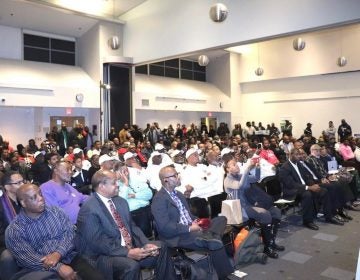 Hundreds of men from anti-violence organizations attend #ManUpPHL at Community College of Philadelphia on Monday in an effort to end gun violence. (The Philadelphia Tribune)