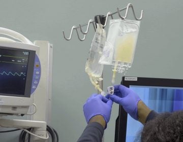 In this January 2019 image made from video provided by Penn Medicine, IV bags of CRISPR-edited T cells are prepared for administering to a patient at the Abramson Cancer Center in Philadelphia. Early results released on Wednesday, Nov. 6, 2019 show that doctors were able to take immune system cells from the patients' blood and alter them genetically to help them recognize and fight cancer, with minimal and manageable side effects. (Penn Medicine via AP)