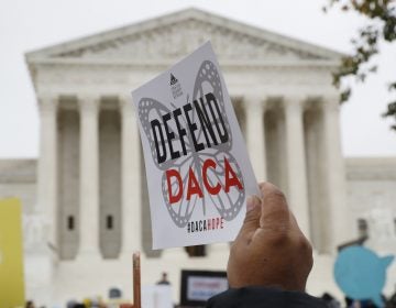 People rally outside the Supreme Court as oral arguments are heard in the case of President Trump's decision to end the Obama-era, Deferred Action for Childhood Arrivals program (DACA), Tuesday, Nov. 12, 2019, at the Supreme Court in Washington. (AP Photo/Jacquelyn Martin)
