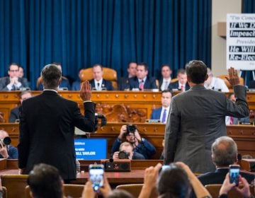 Top U.S. diplomat in Ukraine William Taylor, left, and Career Foreign Service officer George Kent are sworn in prior to testifying before the House Intelligence Committee on Capitol Hill in Washington, Wednesday, Nov. 13, 2019, during the first public impeachment hearing of President Donald Trump's efforts to tie U.S. aid for Ukraine to investigations of his political opponents. (Jim Lo Scalzo/Pool Photo via AP)