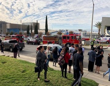 People wait for students and updates outside of Saugus High School after reports of a shooting on Thursday, Nov. 14, 2019, in Santa Clarita, Calif. (Marcio Jose Sanchez/AP Photo)