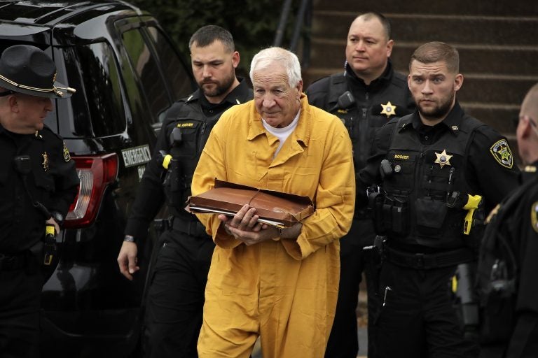 Former Penn State University assistant football coach Jerry Sandusky, center, arrives at the Centre County Courthouse for resentencing on his 45-count child sexual abuse conviction Friday, Nov. 22, 2019. (Gene J. Puskar/AP Photo)