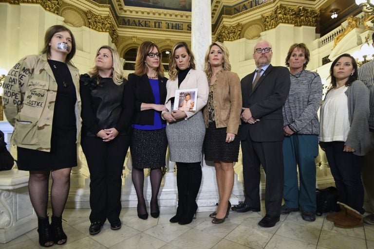 Victim advocate Jennifer Storm, second left, joins survivors of child sexual abuse including Patty Fortney-Julius, third left, and Mary McHale, second right, waiting for a news conference in the Pennsylvania Capitol, in Harrisburg, Pa. (Marc Levy/AP Photo)