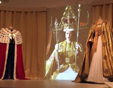 Costumes portraying Queen Elizabeth’s coronation garments are on display at Winterthur Museum in Delaware. (Mark Eichmann/WHYY)
