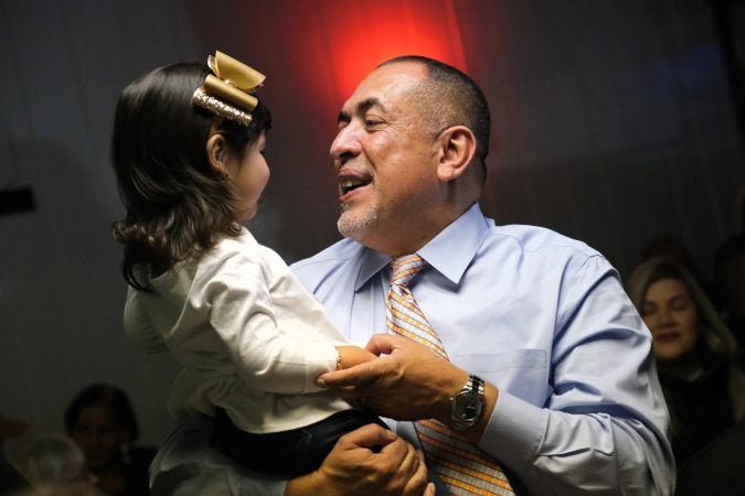 Democratic mayoral candidate Eddie Moran holds his niece Sophia Feliciano, 2, at a campaign event days before polls open. as he is looking to become the first latino mayor of Reading, which has a majority latino population. (Matt Smith for Keystone Crossroads)