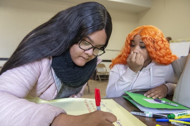 Parkway Northwest High School students Kaila Daniel, left and Makayla Adens, right, during a break out session at a community summit on gun violence. (Jonathan Wilson for WHYY)