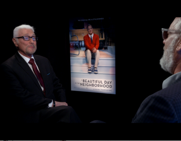 Film critic Patrick Stoner (left) interviews Tom Hanks (right) for his movie, 