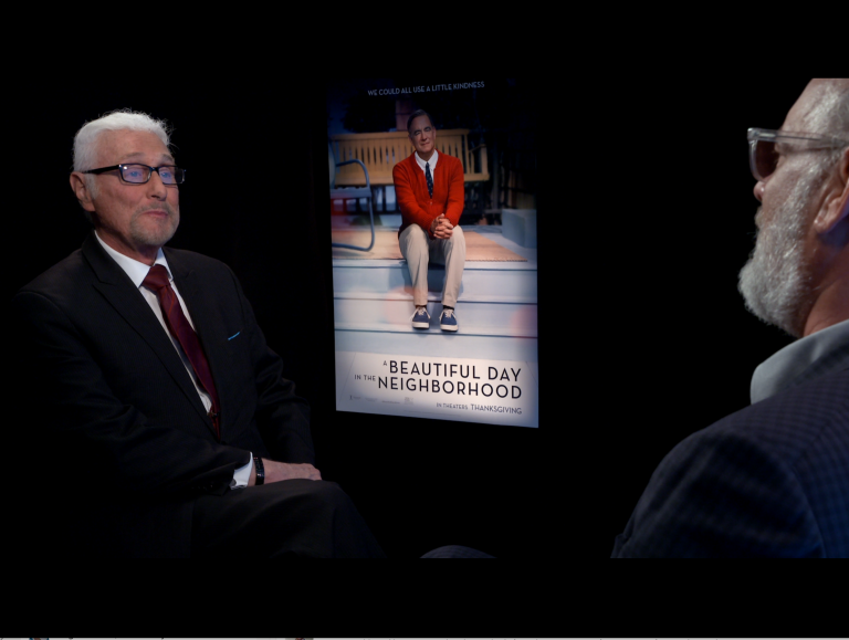 Film critic Patrick Stoner (left) interviews Tom Hanks (right) for his movie, 