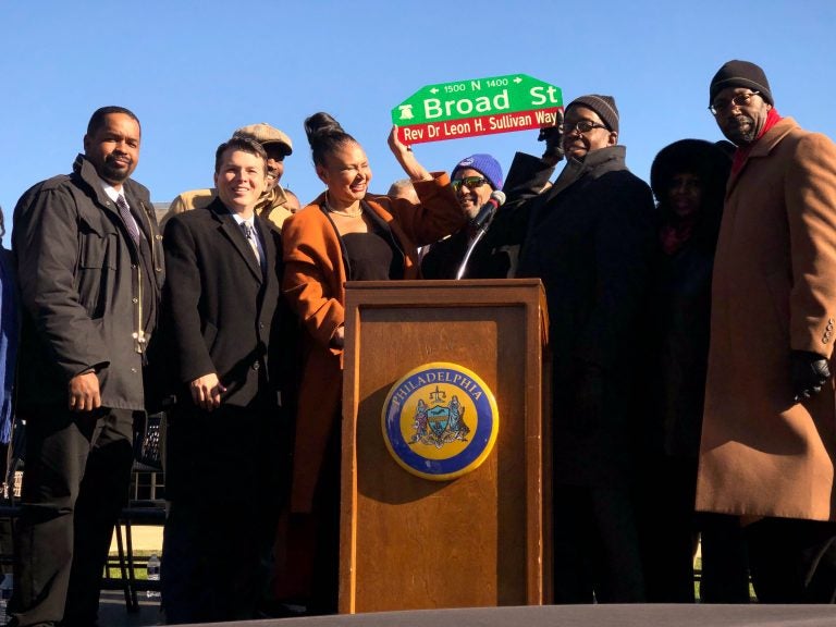 Family members hold up the new street sign named after their patriarch Rev. Dr. Leon H. Sullivan. North Broad Street, between Oxford Street and Girard Avenue, has been renamed Sullivan Way. (P. Kenneth Burns/WHYY)