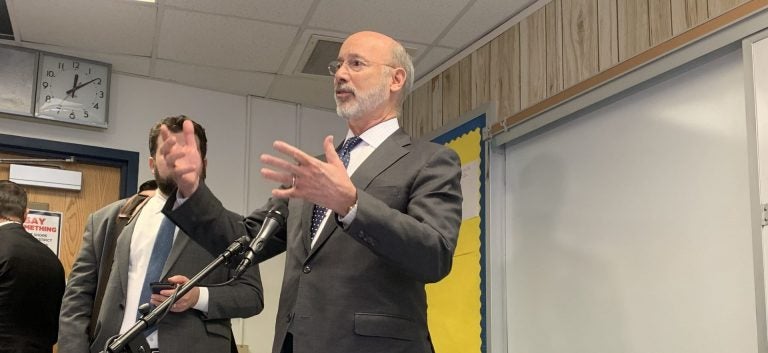 Wolf speaks to reporters after an event in Camp Hill on Nov. 13. (Katie Meyer/WITF)