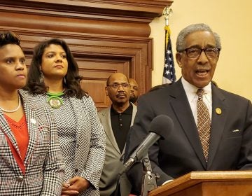 Members of the Legislative Black Caucus, Assemblywomen Shavonda Sumter, left and Britnee Timberlake; Sen. Ron Rice is at the podium. (NJ Spotlight) 