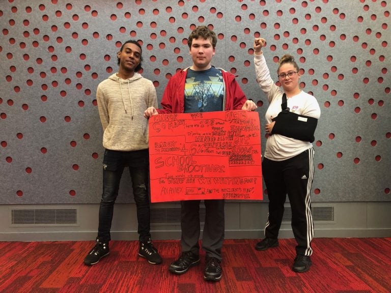 From left, Marshall Everett, Ed Peters, and Sabrina Herb protest the cuts to campus mental health services at HACC, Central Pennsylvania's Community College, on Oct. 23, 2019. (Aneri Pattani/Spotlight PA)