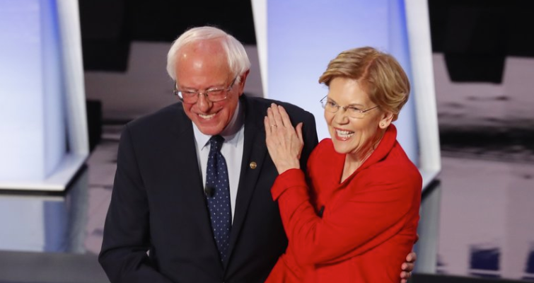 Sen. Bernie Sanders, I-Vt., and Sen. Elizabeth Warren, D-Mass., are proposing to forgive student debt for most Americans. They greet each other at a Democratic primary debate in July. (Paul Sancya/AP Photo)