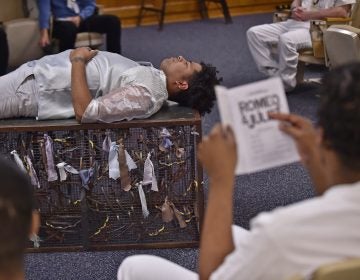 Delaware Shakespeare actor Wilfredo Amill plays the part of Romeo during a performance of Romeo & Juliet held at the Howard R. Young Correctional Institution in Wilmington on Tuesday, November 12, 2019. (Butch Comegys for WHYY)