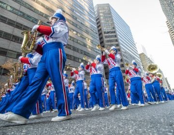 This 2019 photo shows The Morgantown West Virginia High School Marching Band marches along John F Kennedy Blvd during the 100th Philadelphia Thanksgiving Day Parade. (Jonathan Wilson for WHYY)