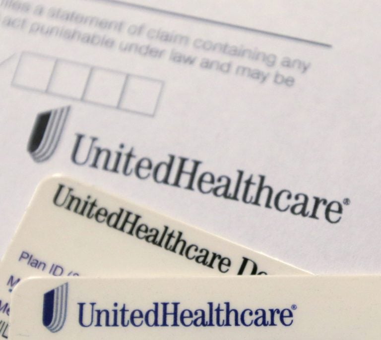 In this Friday, June 15, 2018 file photo, UnitedHealthcare cards and forms are shown in Doral, Fla. (Wilfredo Lee/AP Photo) 