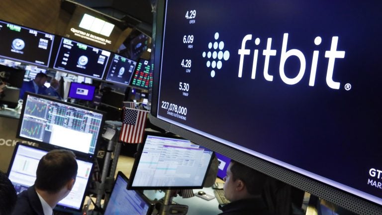 Fitbit, a pioneer in wearable fitness trackers, is being acquired by Google for $2.1 billion. (Richard Drew/AP Photo)