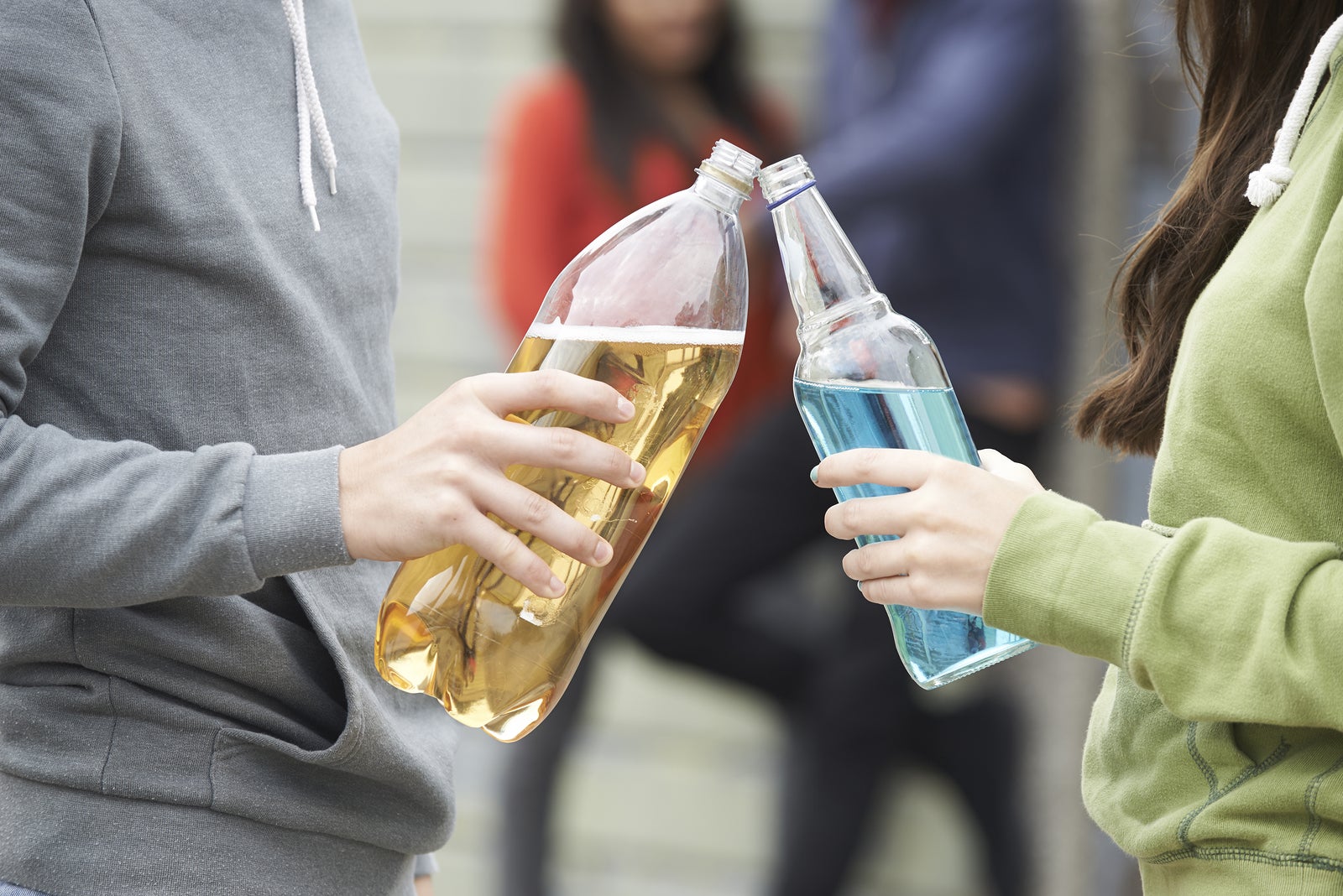 Teenager holding large bottle of water, Stock image